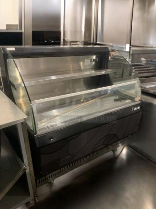 Immaculate Turbo Air TOM-50LB open display refrigerator, 120V, tested, working, curved glass front, black finish.
