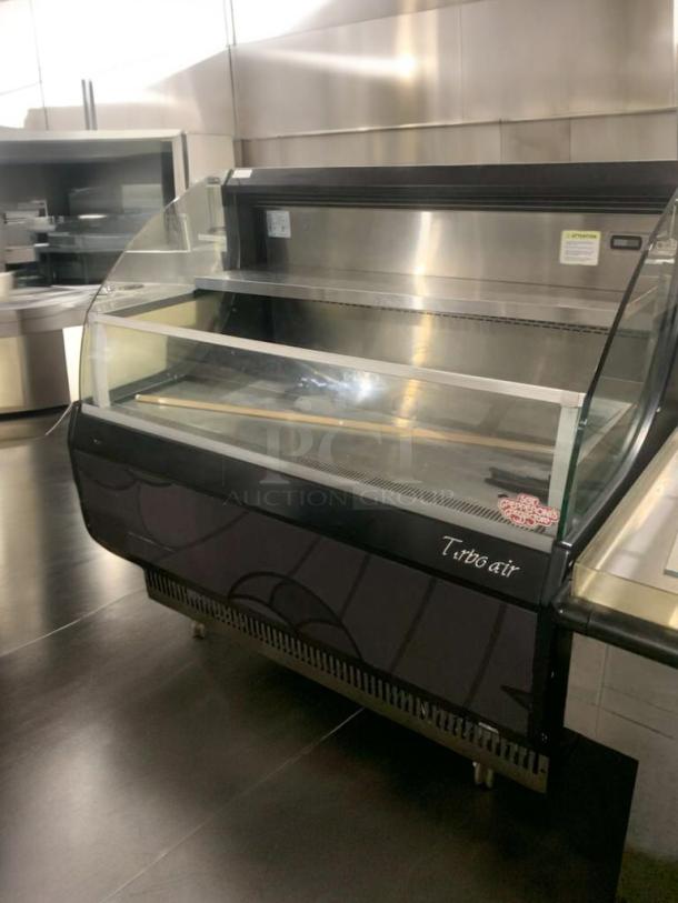Turbo Air TOM-50LB open display refrigerator in immaculate condition, 120V, fully tested and working, features clear glass and shelving.