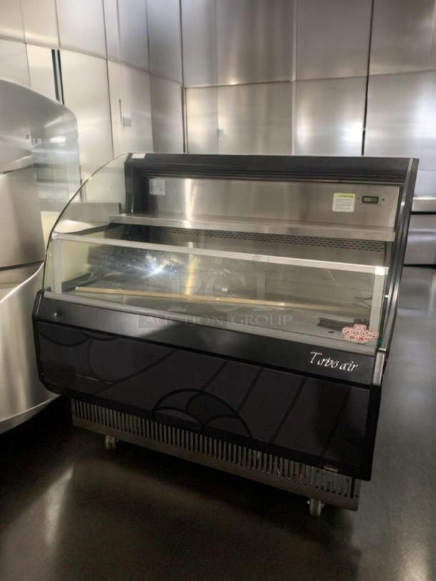 Immaculate Turbo Air TOM-50LB open display refrigerator, 120V, fully tested and working, sleek design, visible label.
