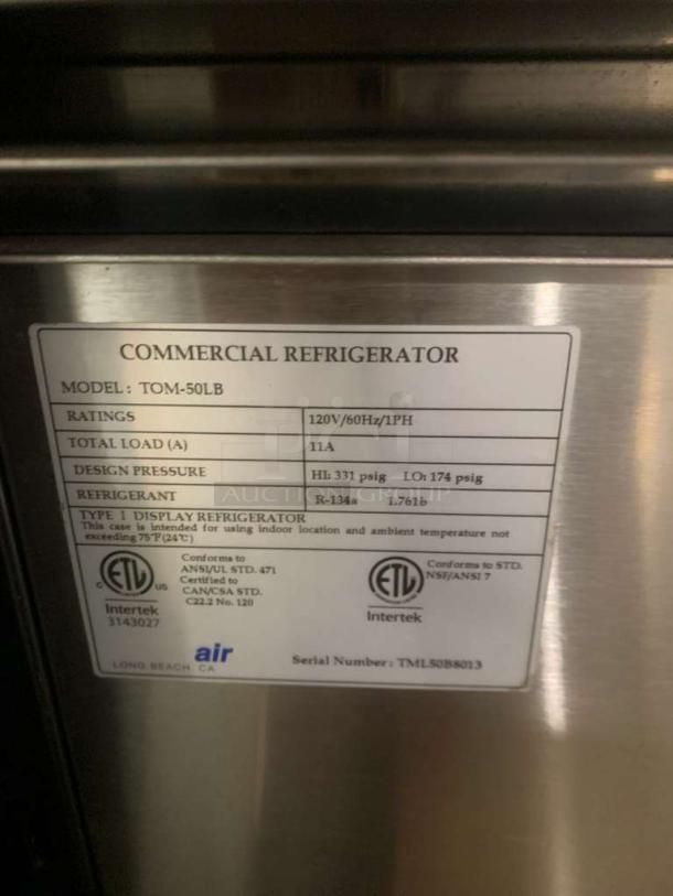 Turbo Air TOM-50LB open display refrigerator label, showing 120V rating, design pressure, R-134a refrigerant, in immaculate condition.