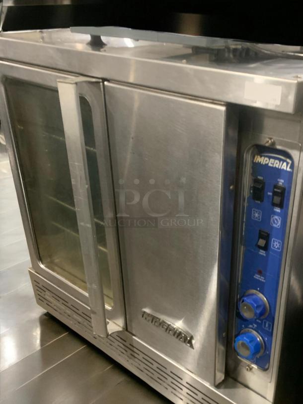 Imperial convection oven, natural gas, prime condition, fully tested. Features control dials and glass door. Model: Standard Imperial.