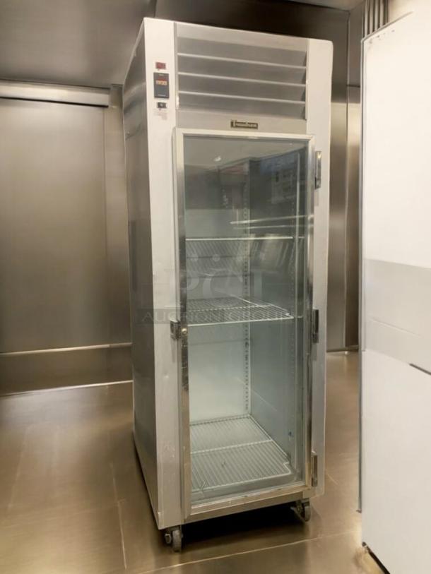 Traulsen G11010 commercial glass door refrigerator, 115V, prime condition, fully tested and working, with adjustable shelves.