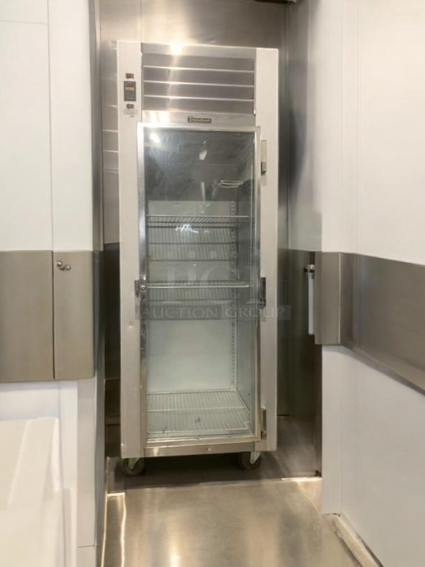 Traulsen G11010 commercial glass door refrigerator in prime condition, 115V, fully tested, with adjustable shelving.