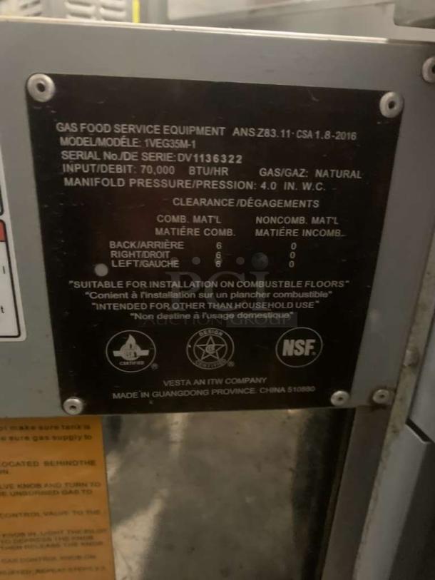 Vulcan 1VEG35M-1 natural gas fryer tag, shows model, 70,000 BTU, serial DV1136322, suitable for commercial use, NSF certified.