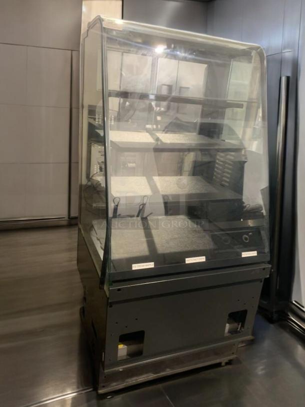 Commercial heated food display case, superior condition, multiple shelves, glass front, fully tested and working.