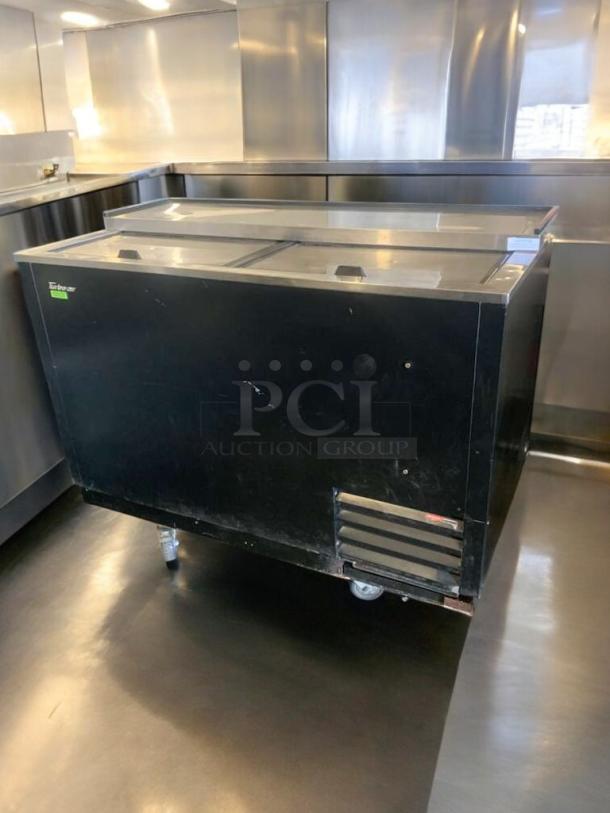 Turbo Air TBC-50SB-N6 bottle cooler, top-tier condition, fully tested, 115V, black exterior, sliding lids, on casters.