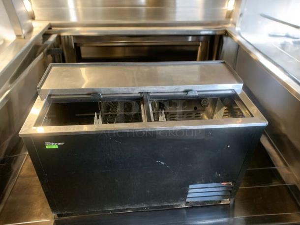 Turbo Air TBC-50SB-N6 beer cooler, top condition, 115V, black exterior, sliding lid, fully tested, model label visible.