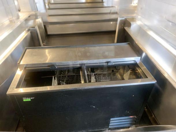 Turbo Air TBC-50SB-N6 bottle cooler, top-tier condition, 115V, open lid showing interior, black exterior with minor wear.