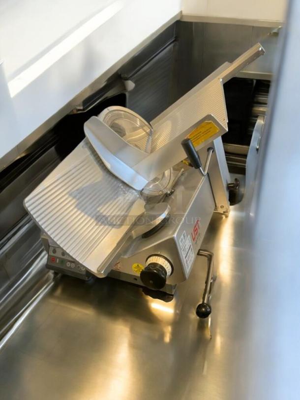 Pristine Bizerba GSP HD meat slicer, heavy-duty, 120V, fully tested and working, with adjustment knobs and safety markings.