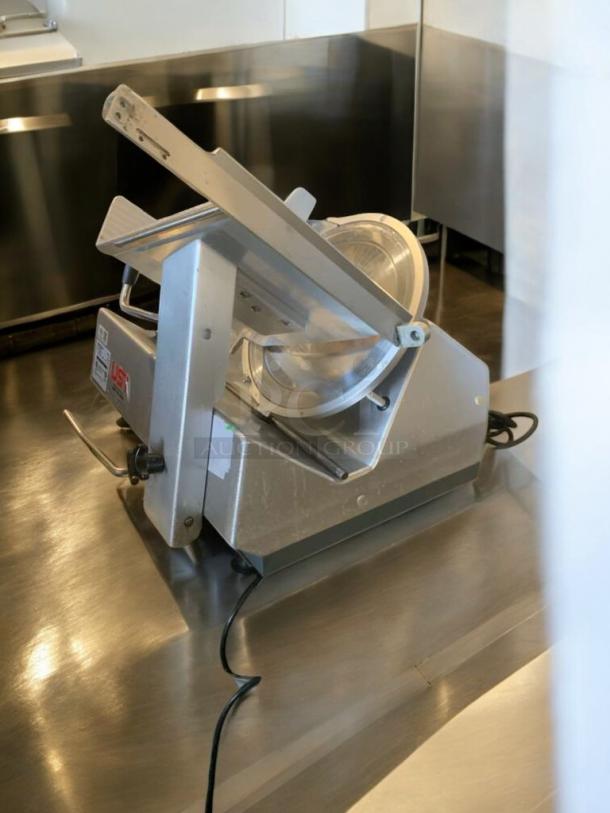 Bizerba GSP HD meat slicer in pristine condition, 120V, heavy-duty model T-11, fully tested, on stainless steel countertop.