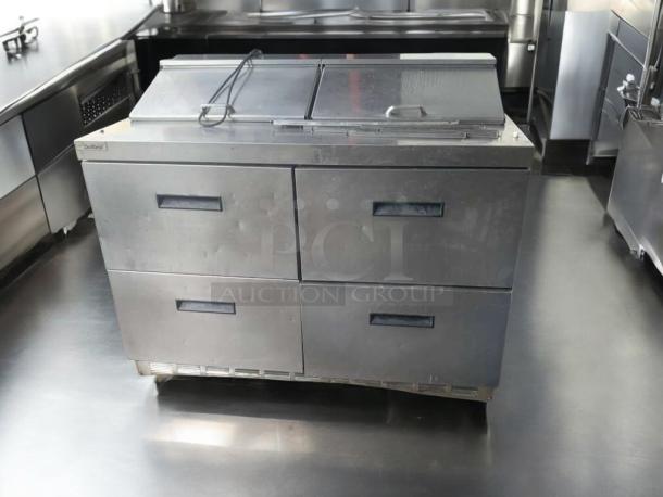 Prime condition Delfield D4488N-12-A3 refrigerated prep table, 115V, with four drawers, fully tested and working.
