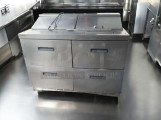 Prime condition Delfield D4488N-12-A3 refrigerated prep table, 115V, with four drawers, fully tested and working.