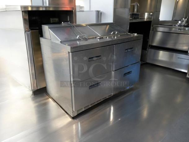 Delfield D4488N-12-A3 refrigerated prep table, prime condition, stainless steel, four drawers, tested and working, 115V.