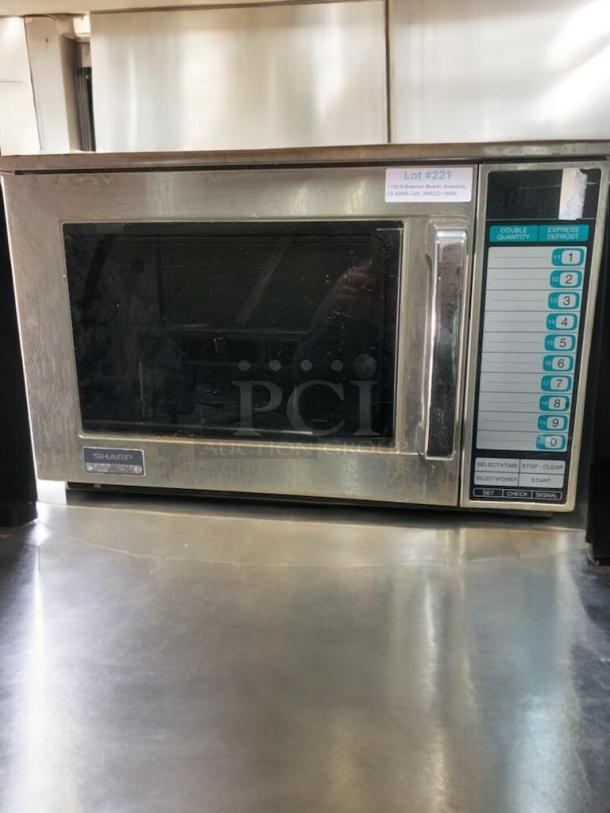 Sharp commercial microwave, heavy-duty model, in prime condition. Fully tested and operational with control panel visible.