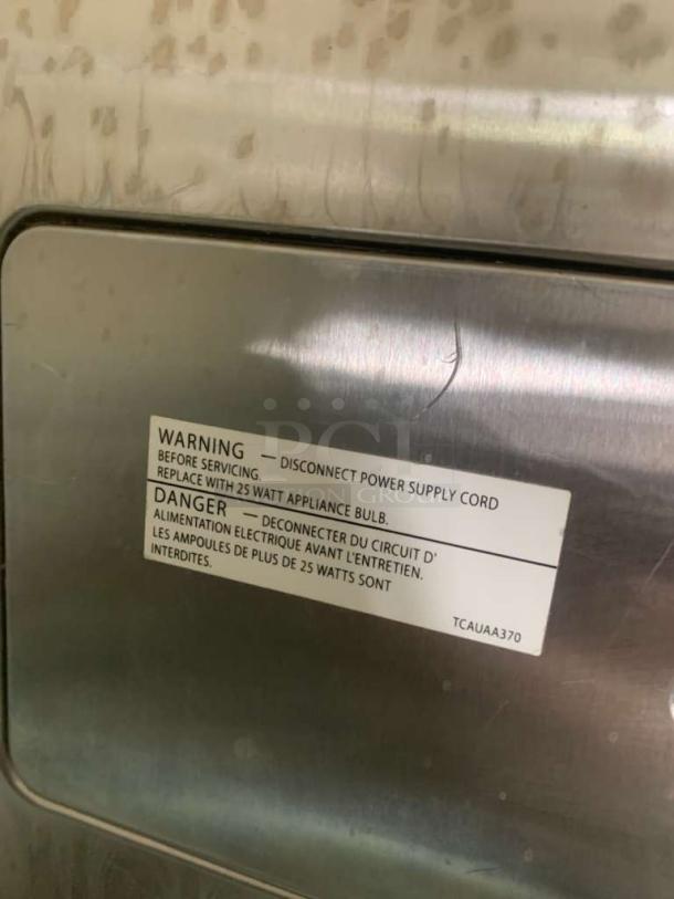 Sharp commercial microwave, heavy-duty model, label warning to disconnect power before servicing, replace with 25W bulb.