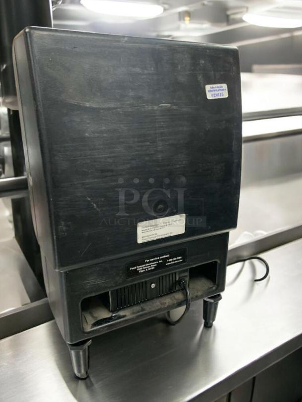 Food Concept Developers D-PSPD-5 powder dispenser, impeccable condition, 120V, fully tested. Tags show model and service contact.