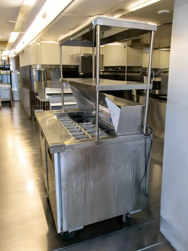 Turbo Air TSU-4RW-N6 refrigerated prep table in prime condition, fully tested, 120V, durable stainless steel, on wheels.