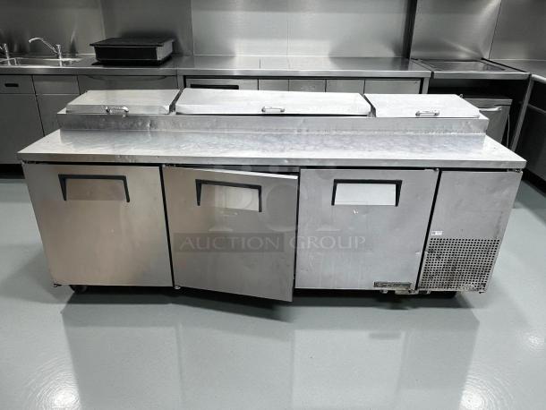 True TPP-93 refrigerated pizza prep table, 93", three doors, stainless steel, good condition, tested and working.