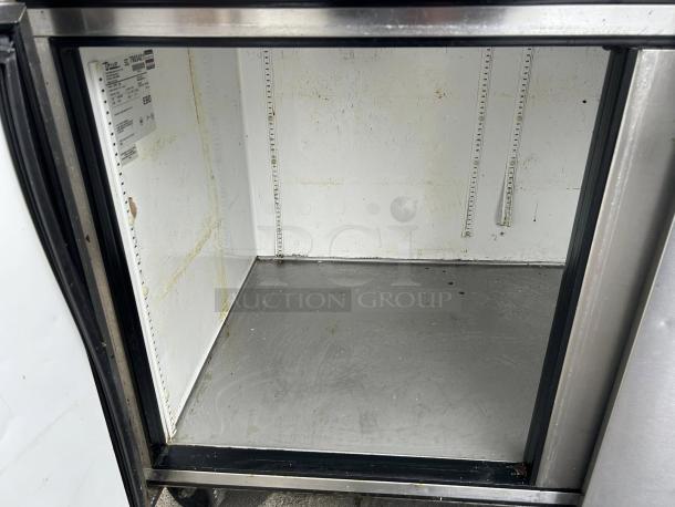 True TPP-93 93" 3-door refrigerated pizza prep table, tested and working. Interior shows wear. Features stainless steel construction.
