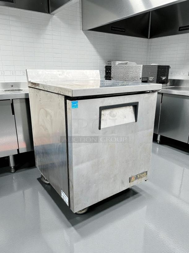 True TWT-27F-HC 28" worktop freezer, excellent condition, right hinge door, tested and working, visible brand label.