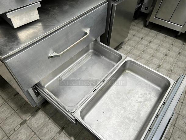 Randell FX-2WS-290 chef base with two drawers, stainless steel, 43 1/4", tested, and working. Ideal for kitchen use.