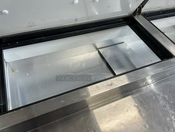 Kintera KRR70X two-door pizza prep refrigerator, stainless steel, fully tested, great condition, open top view.