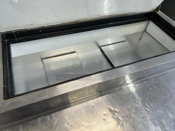 Kintera KRR70X two-door pizza prep refrigerator, 115V, in great condition, stainless steel finish, fully tested and working.