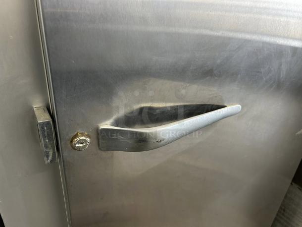 Traulsen G10010 30" G Series refrigerator, solid right-hinged door, tested and working, metal handle, slight wear visible.