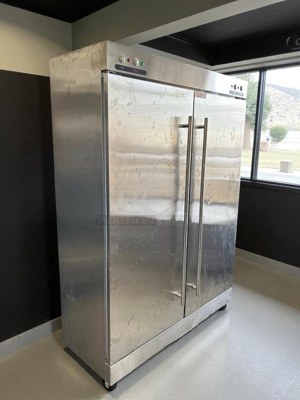 Stainless steel 2-door refrigerator, model XDR640-F1A, in excellent condition with visible control panel.