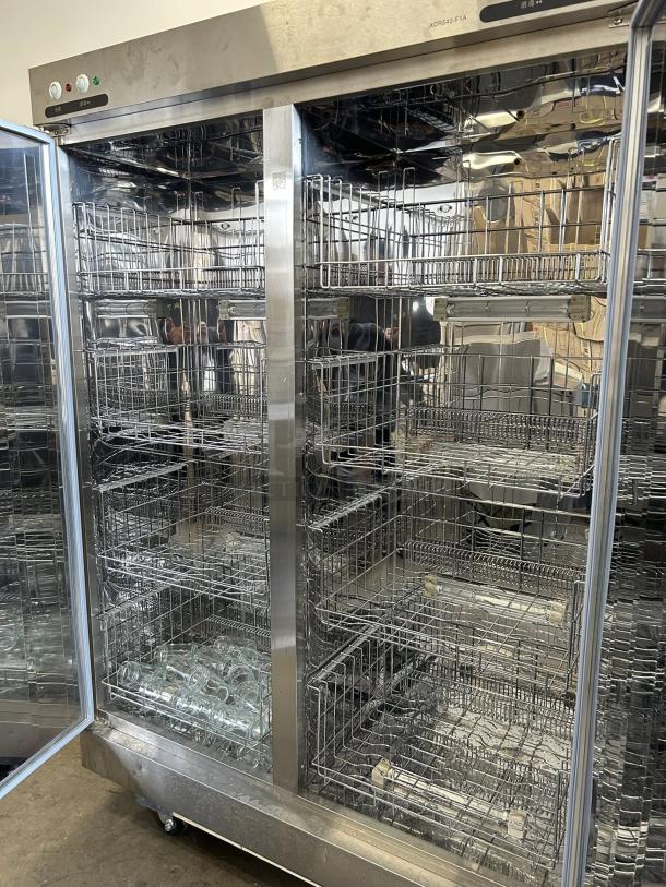 Two-door refrigerator model XDR640-F1A, excellent condition, stainless steel, interior wire shelves, tested and working.