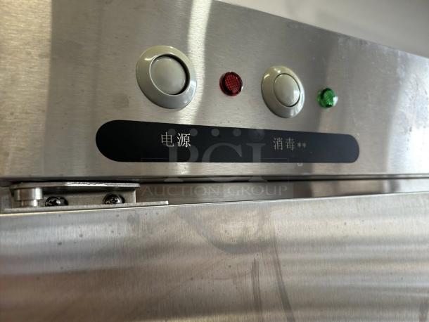 Stainless steel 2-door refrigerator, Model XDR640-F1A. Features power and disinfection buttons. Excellent condition.