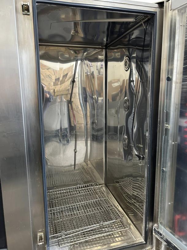 Electrolux Air-o-Steam AOS202GTP1 natural gas combi oven, stainless steel, excellent condition, interior racks visible.