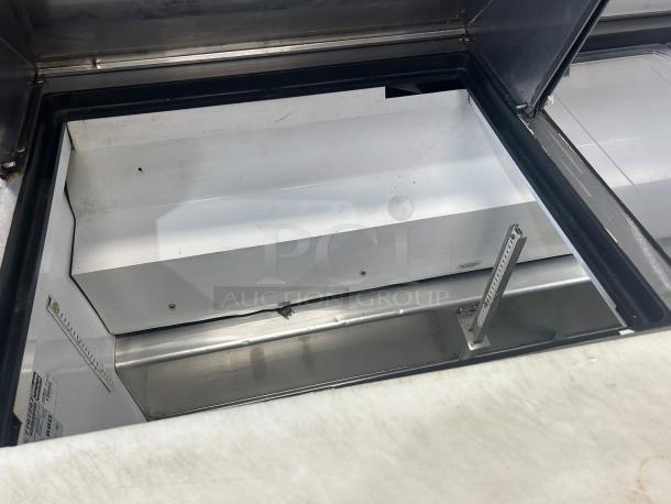 True TSSU-60-24M-B-ST-HC sandwich prep table, open lid view. Excellent condition, tested working, spacious interior.