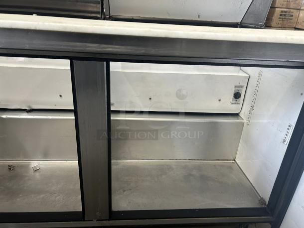 True TSSU-60-24M-B-ST-HC 60" 2-door refrigerated prep table, excellent condition, stainless interior, tested and working.