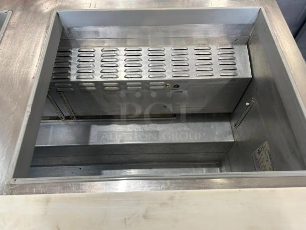 Continental SW60N24M 60" mega top refrigerated prep table, excellent condition, stainless steel interior, working order.