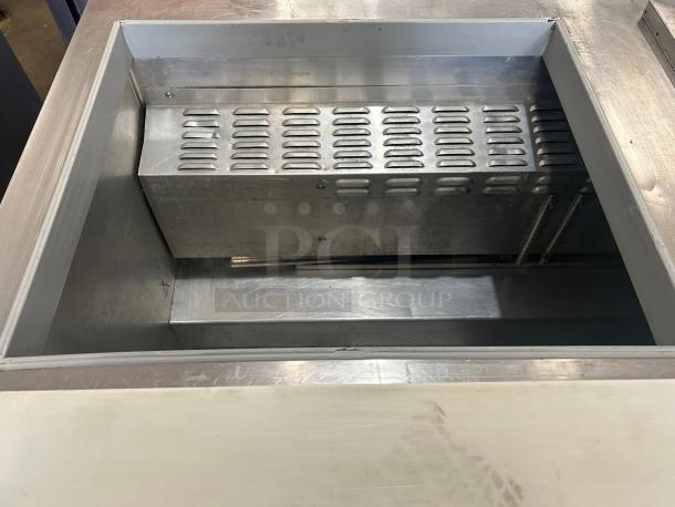 Continental SW60N24M 60" 2-door refrigerated sandwich prep table, excellent condition, stainless steel interior.