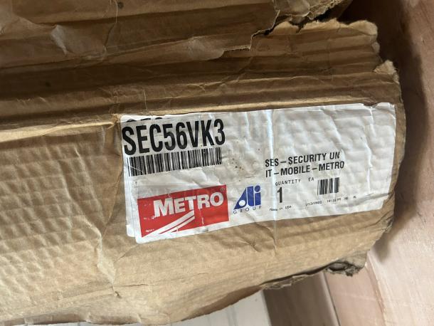 Brand new Metro SEC56VK3 mobile wire security cabinet box with Metroseal 3 finish tag. Marked "Made in USA."