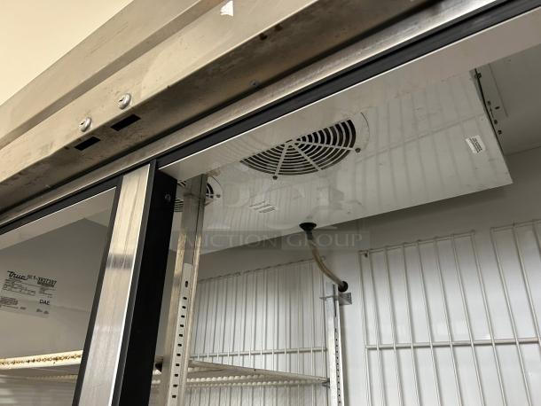 True TS-49F-HC 54" reach-in freezer, 2 sections, solid door, excellent condition, tested, interior view with shelves.