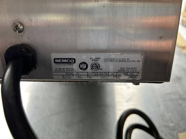 Nemco 6310-2-240 cast iron burner, excellent condition; features two 1.5kW elements. Label shows model, voltage, and certifications.