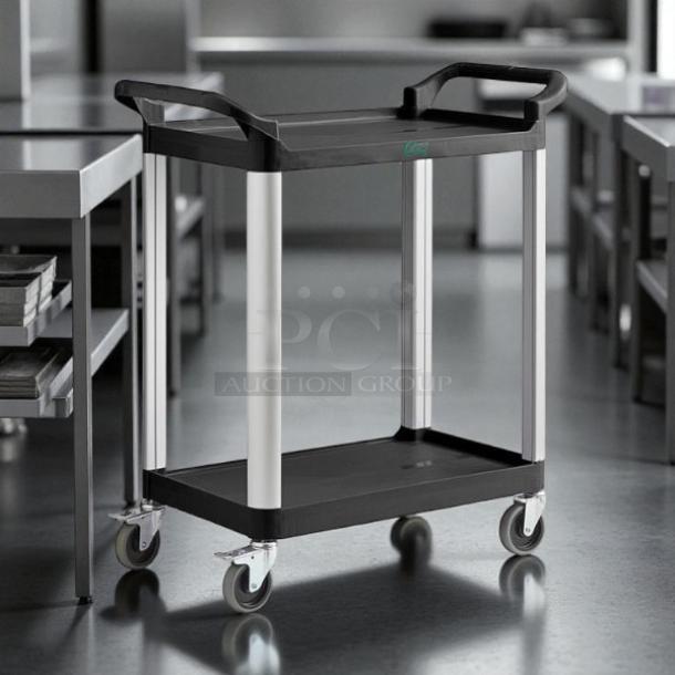 Brand new Choice purple utility cart with two shelves, 24" x 16". Features sturdy wheels and handles, ideal for bussing tasks.