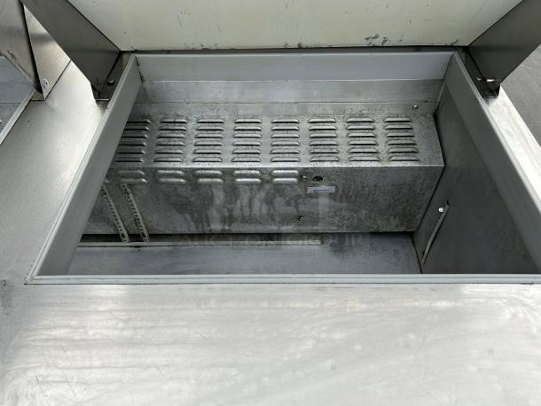 Continental SW60N24M 60" 2-door refrigerated prep table interior, metal finish, tested and working condition.