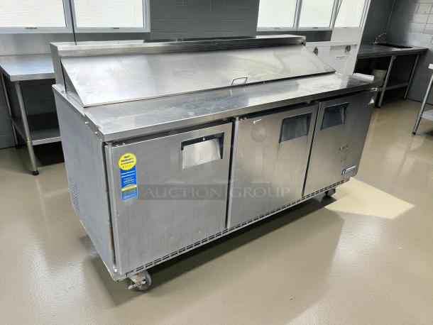 Everest EPBNR3 71" stainless steel refrigerated prep table, 3 solid doors, tested and working, with visible manufacturer label.
