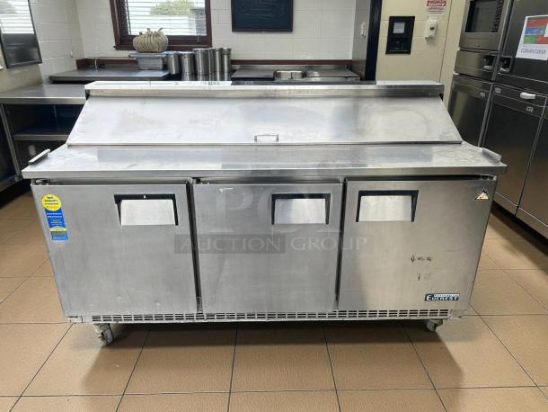 Everest EPBNR3 71" stainless steel refrigerated prep table with 3 solid doors, tested and working, in good condition.