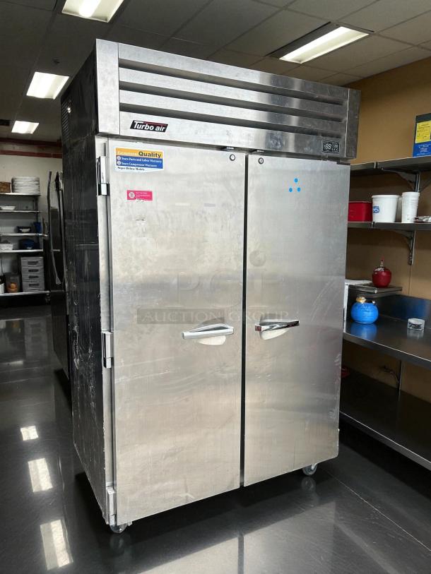 Turbo Air PRO-50F-N freezer, 48.3 cf, stainless steel, 2 solid swing doors, excellent condition, warranty sticker visible.