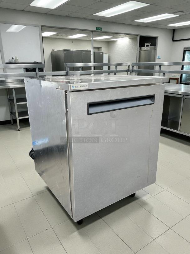 Delfield 4427NP undercounter refrigerator, stainless steel, 27"W, single door, good condition, tested working.