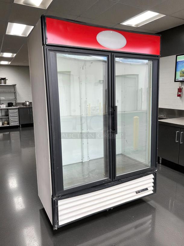 True GDM-49-HC~TSL01 refrigerated glass door merchandiser, black, 54 1/4", great condition, tested and working.