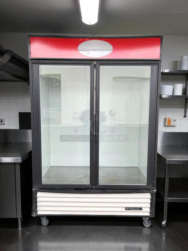 True GDM-49-HC~TSL01 54 1/4" black refrigerated glass door merchandiser in great condition, tested and working.