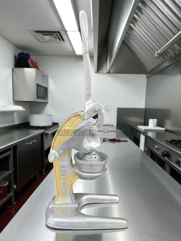 Chav Rub manual orange juice press, good condition, metallic finish, tested and working. Model name visible on the side.