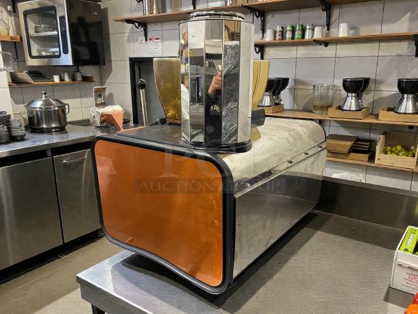 Thermoplan Mastrena II 2 espresso machine with pump, 208-240V, tested and working. Stainless steel finish in kitchen setting.