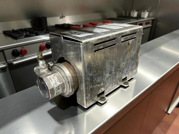 Thermoplan Mastrena II espresso machine pump, stainless steel, showing wear, tested working, voltage 208-240V.